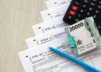 WNI tinggal di luar negeri lebih dari 6 bulan harus lapor SPT atau tidak